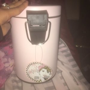 A pink mini trash can